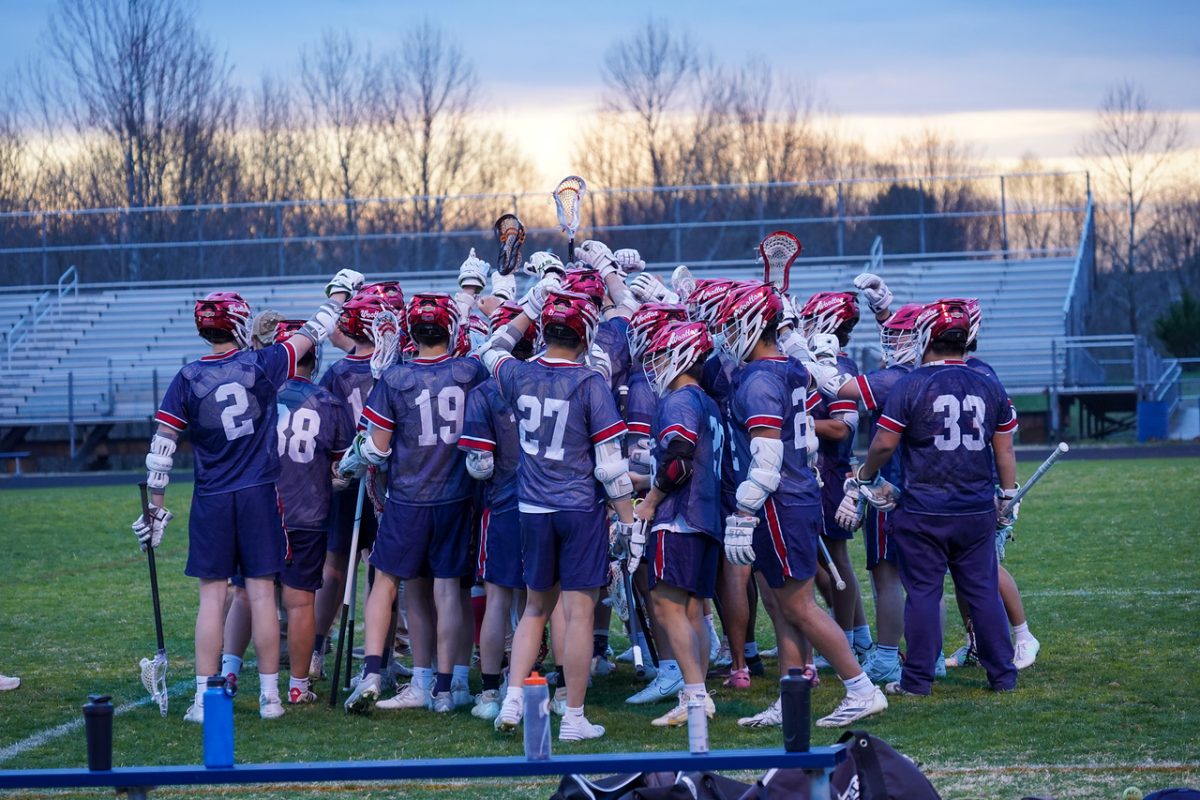 Boys' lacrosse played Magruder on March 25 as their first game of the season, and beat them 11-10 in a close game. Photo courtesy Max Lee