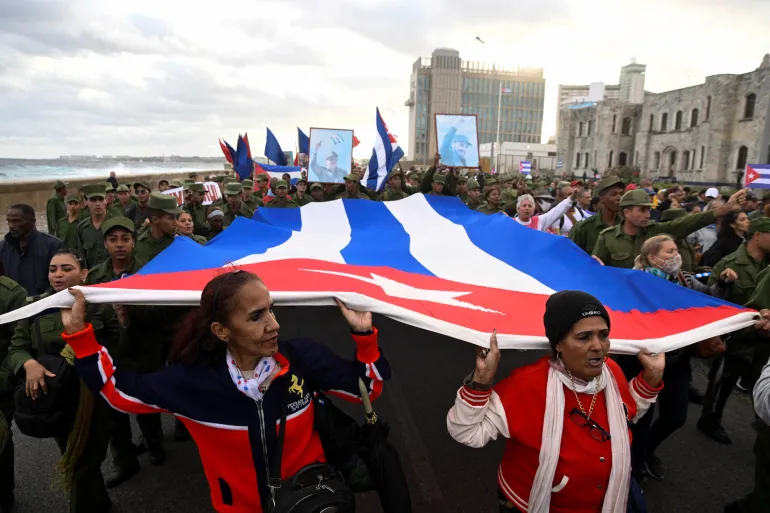 A march outside the U.S. Embassy in Havana protests against further American involvement in Cuba following the abduction of Venezuelan dictator Nicolas Maduro. The protest brought in a crowd of several thousand individuals, including Cuban military personnel and government employees, on Jan. 16, 2026. "Havana protest against US policies" by Norlys Perez is licensed under CC0.