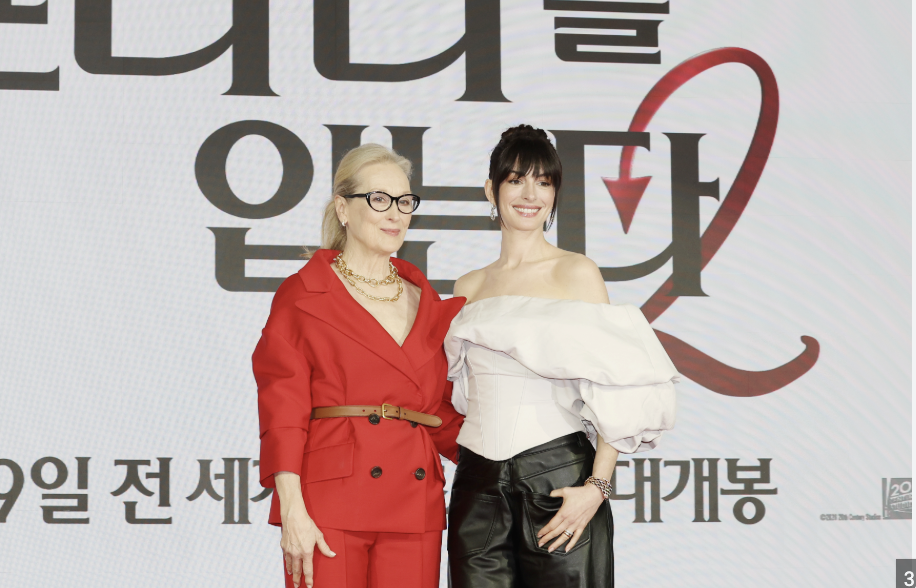 Meryl Streep and Anne Hathaway pose  at the "Devil wears Prada 2" premier. "press conference for The Devil Wears Prada 2" by Wikimedia is licensed under CCBY-NO2.0