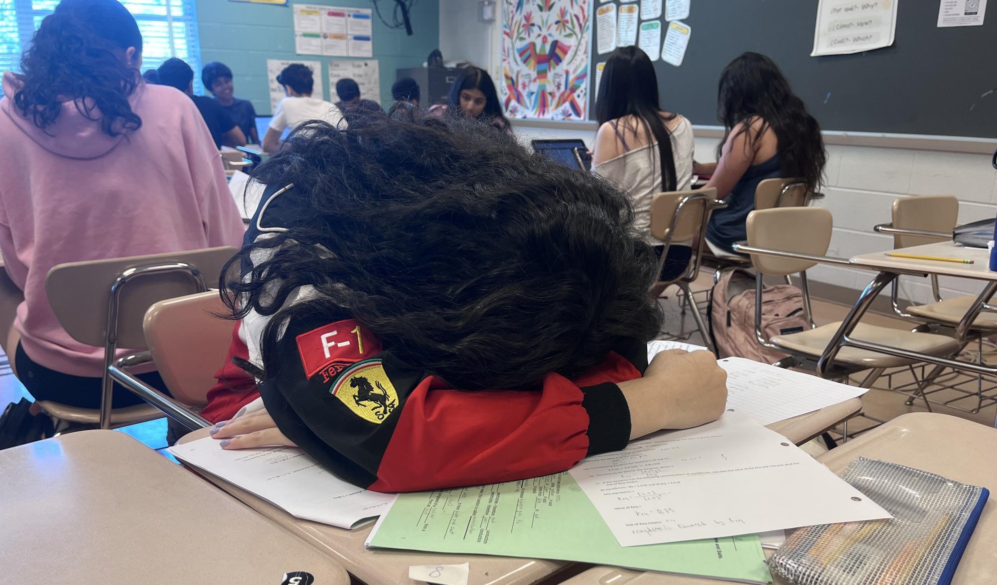 Sophomore Jessie Zhu sleeps during her fourth period Spanish class. As sophomore year comes to a close, Zhu feels burnt-out, but overwhelming homework assignments continue to accumulate.