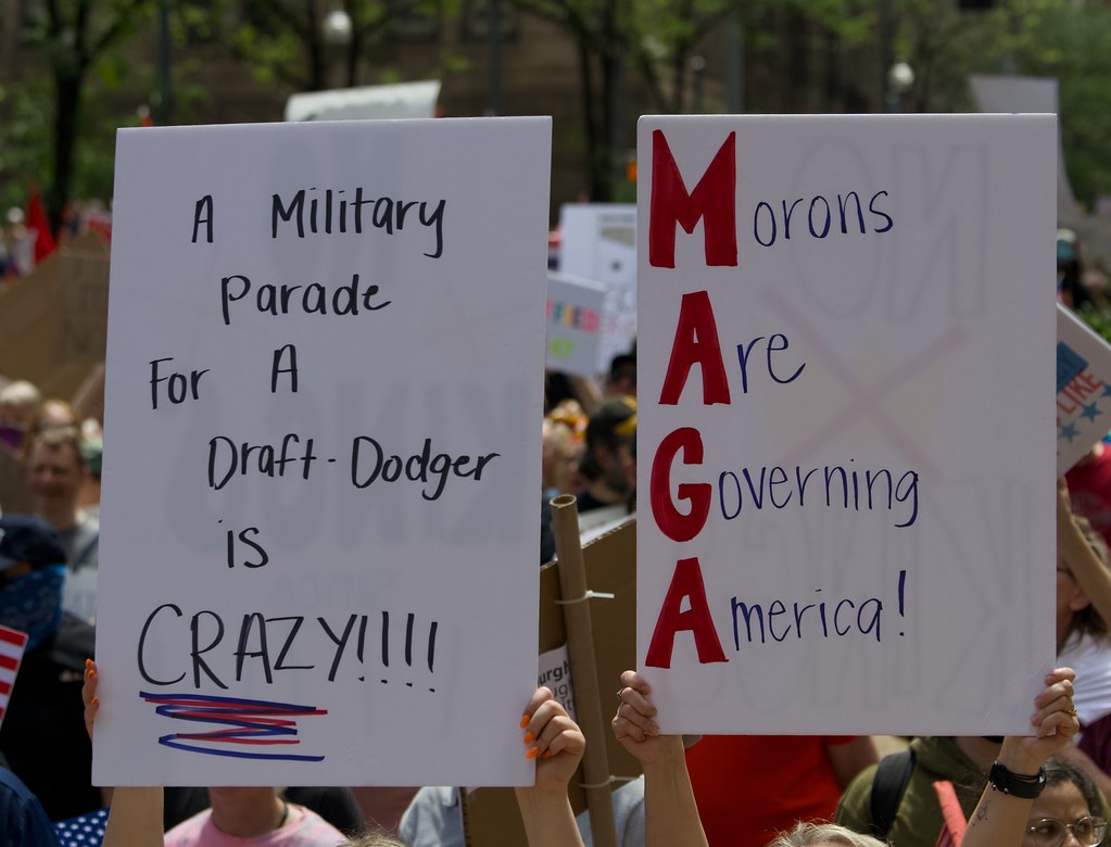 The military draft has widely been unpopular among Americans.  According to Gallup News, 45% of Americans are opposed to required sign up for the Selective Service and for those under the age of 30, it increases to 57%.  "Pittsburgh #NoKings Rally June 14, 2025" by TheNoxid is licensed under CC BY 2.0.