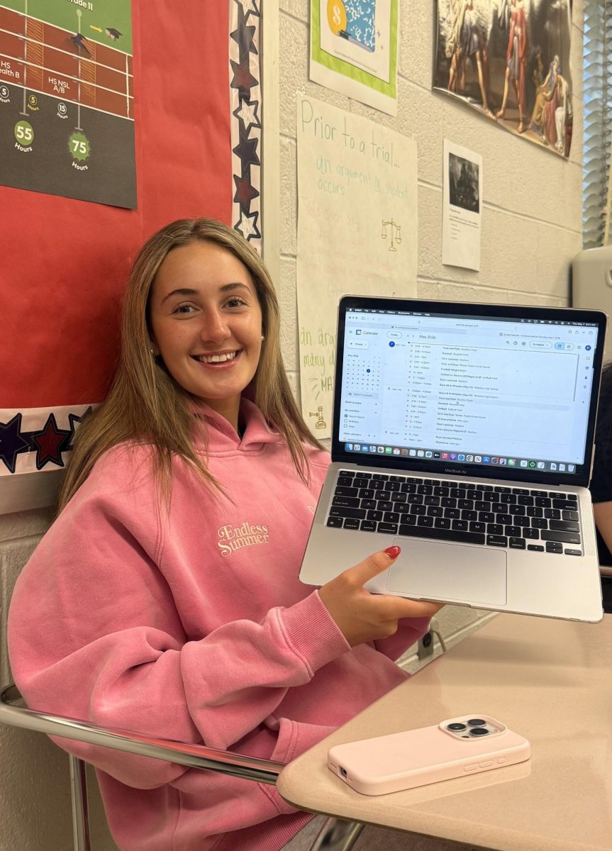 Senior Peyton Higgins, an intern for the athletic director, scrolls through the spring sports practice schedule to make sure all practices are properly timed and there are no coordination errors. "Rarely do we ever have any problems with the practice times because Mr. Lightsey always handles it with the coaches in advance to prevent any issues later," Higgins said. Photo courtesy Annalise Yi