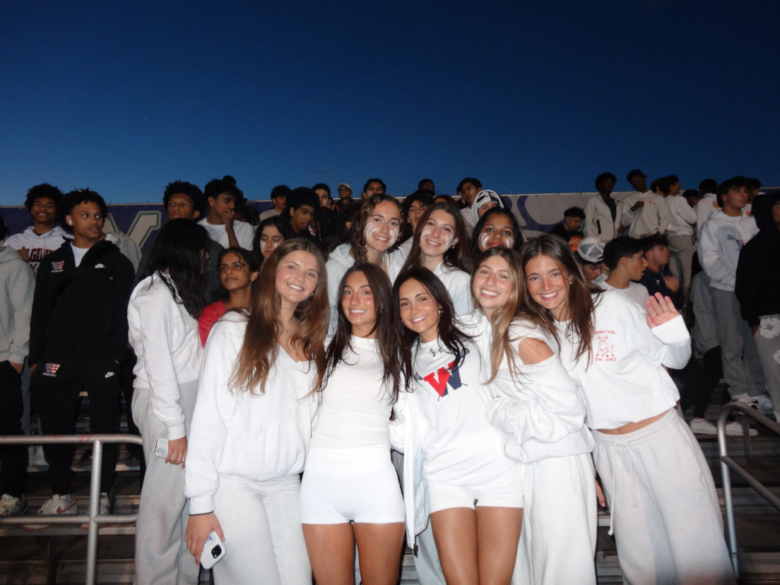 Sami Karcz and friends Mia Coven, Marley Hoffman, Danielle Rubin,and Siena McCarthy enjoy their last rivalry football game against Churchill on Oct. 24, 2025. Photo courtesy Sami Karcz