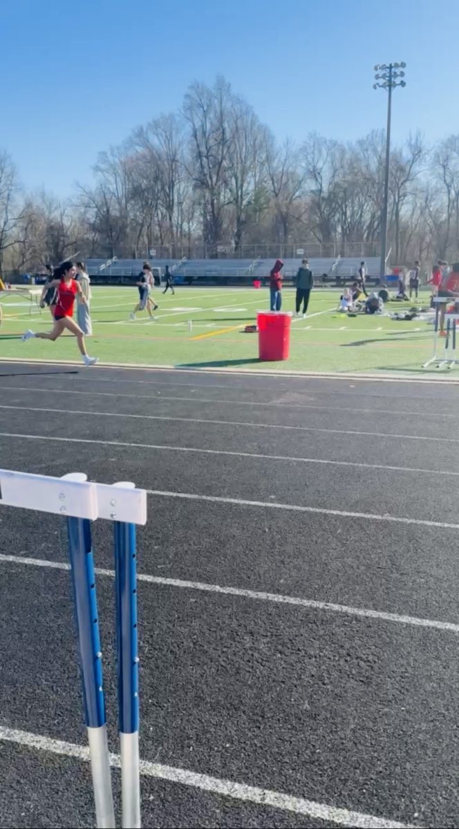 Sophomore Arianna Agrawal completes her daily mile warm-up before the official track meet begins, on March 24. Her goal is to show her commitment to her sport and athletic discipline. “I believe that the sport of track takes the most time to practice because I typically practice six times per week. This level of commitment takes consistency and endurance to improve and see change happening physically and mentally over time,” Agrawal said.