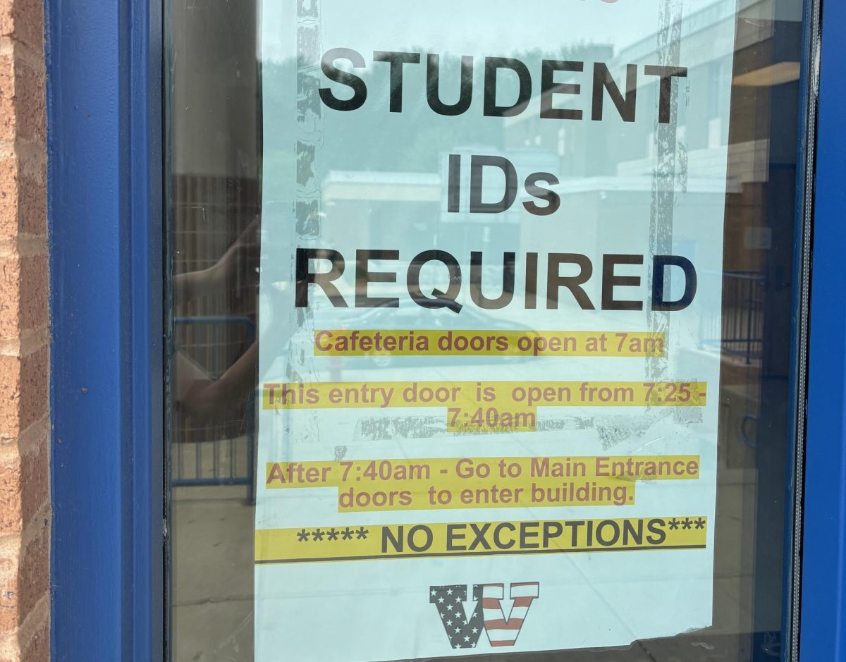 A sign in the window next to the lower lot doors reads, "This entry door is open from 7:25 to 7:40 a.m." and instructs students to enter the building through the Main Entrance in the front of the school after 7:40. This is the same information outlined in a newsletter sent out by Principal Dr. Joseph Bostic to students, families, and staff shortly after the shooting on Feb. 9. The policy was implemented after the shooting to increase safety precautions and ease the arrival of "little Patriots," or the preschool-aged participants in this school's child development program.