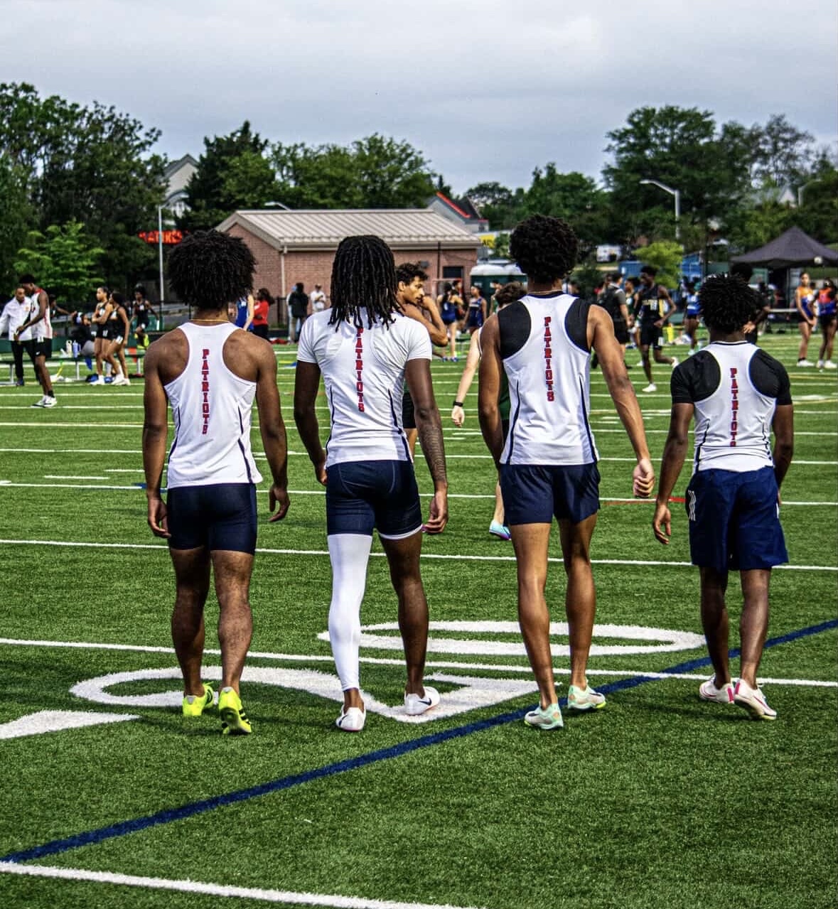Track athletes pre-run in the MCPS County A's on May 6. Photo by junior Khalil Sutherlin