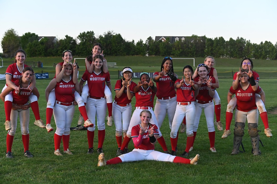 The girls' varsity softball team celebrates after a win against Magruder in the regional semifinals. This was a revenge game because the team lost against Magruder in the regular season, making the win stand out for girls. Sophomore Justice Key said that this year, compared to last year, the team has utilized spirit to fight back during games that seem impossible to win. Photo by Annika Rytting