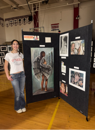 Junior Olivia Shin spent the afternoon talking with visitors about her artwork and sharing her creative process during the Art Fair. “It felt good to get feedback and hear what people liked,” Shin said.