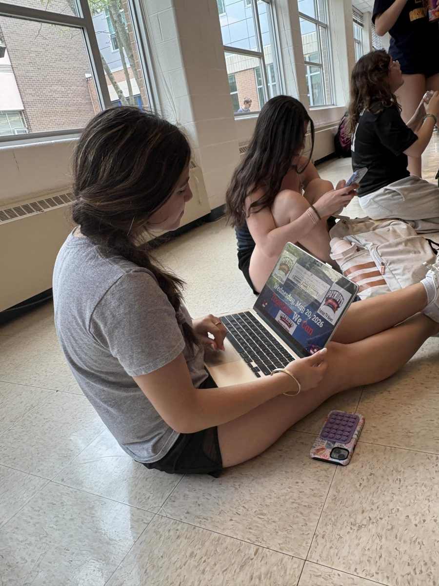 Junior Lily Zaiderman watches the morning announcements on May 20 during lunch. May 20 announcements are the only one available to students in the month of May. "I was not shown the announcements so I decided to watch it during lunch," junior Lily Zaiderman said.