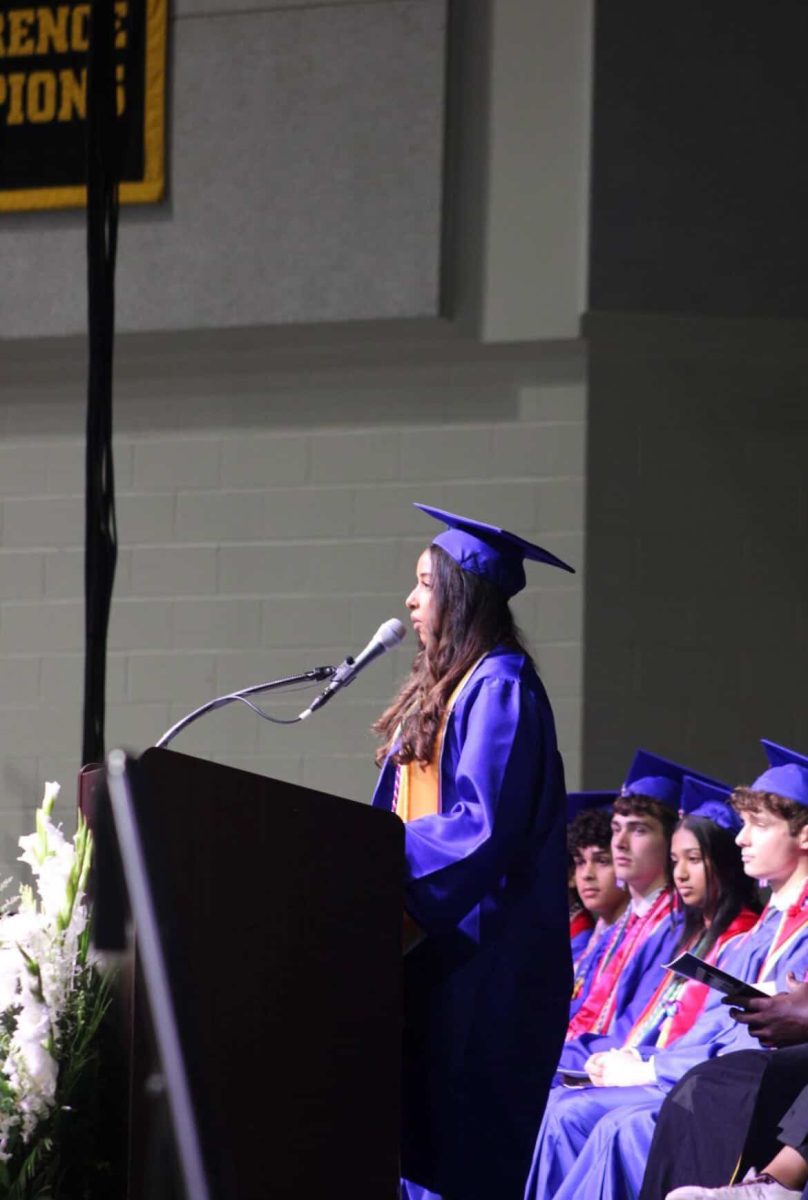 2026 graduate Roshali Abeywarna presents as the selected student speaker at graduation. The photographer, junior Peace Tiam, attended graduation and took similar pictures for the graduates, all of which they can access from her Google Drive. Photo by Peace Tiam